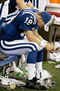 Indianapolis Colts quarterback Peyton Manning prays during the AFC Championship games