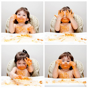 Messy baby trying new foods